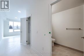 Hamilton (Kirkendall) house for rent - A white bathroom with a toilet and a shower stall.