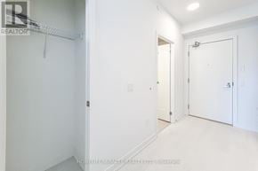Hamilton (Kirkendall) house for rent - A white room with a door and a shelf.