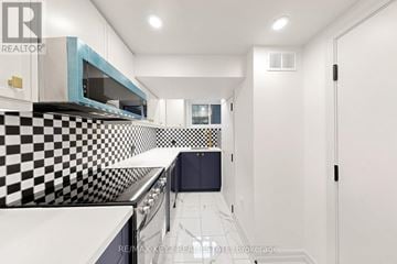 Whitby (Downtown Whitby) apartment for rent - A modern kitchen with black and white checkered backsplash.