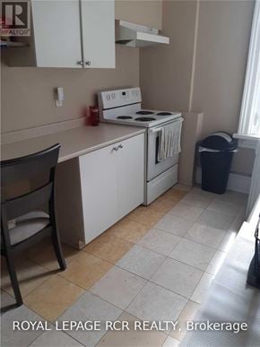 Caledon (Bolton West) multi-family for rent - A kitchen with a white stove and white cabinets.