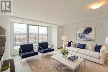 Toronto (Alderwood) condo for rent - A living room with a white couch, blue chairs, and a painting on the wall.