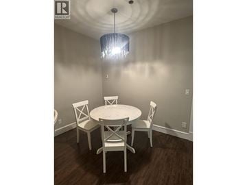 West Vancouver apartment for rent - A dining room with a white table and chairs.
