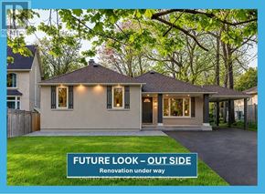 Richmond Hill (North Richvale) apartment for rent - A house with the words "FUTURE LOOK - OUT SIDE" on a sign in front of it.
