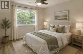 Richmond Hill (North Richvale) apartment for rent - A bedroom with a bed, nightstands, and a ceiling fan.