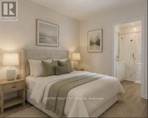 Richmond Hill (North Richvale) apartment for rent - A bedroom with a large bed and a painting on the wall.