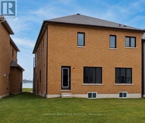 Georgina (Keswick North) apartment for rent - A brick house with a black door and windows is for sale.