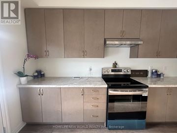 Georgina (Keswick North) apartment for rent - A kitchen with a stove top oven and cabinets.