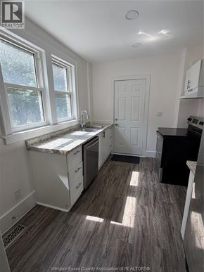 Windsor apartment for rent - A kitchen with a sink under a window.