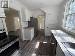 Windsor apartment for rent - A kitchen with a stove, oven, and sink.