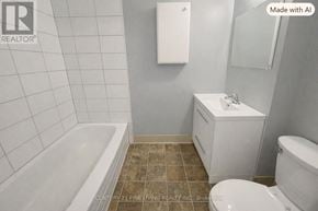 Barrie (City Centre) apartment for rent - A white bathtub sits next to a toilet in a bathroom.