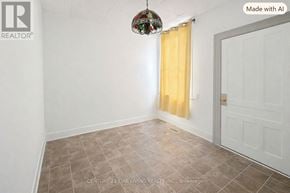 Barrie (City Centre) apartment for rent - A room with a white door and a yellow curtain.