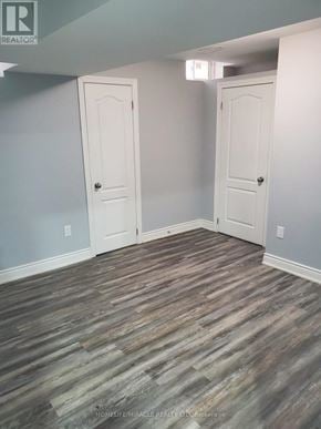 Brampton (Bram East) apartment for rent - A room with wood flooring and two white doors.