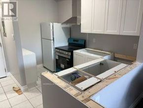Caledon (Bolton North) apartment for rent - A kitchen undergoing renovation with cabinets and appliances removed.