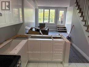 Caledon (Bolton North) apartment for rent - A kitchen under renovation with cabinets and appliances in place but no countertops.