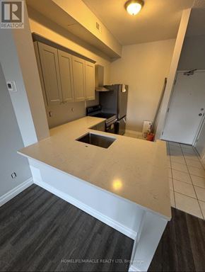 Caledon (Bolton North) apartment for rent - A kitchen with a countertop and cabinets.