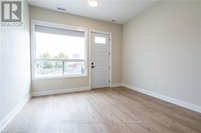 Hamilton (Hampton Heights) apartment for rent - A room with a door and a window.