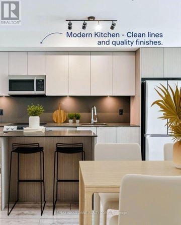 Oakville (Br Bronte) condo for rent - A modern kitchen with clean lines and quality finishes.