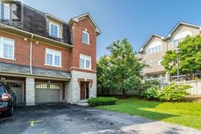 Pickering (Village East) townhouse for rent - A large brick house with a garage is for sale.