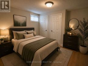 Newmarket (Central Newmarket) apartment for rent - A well-lit bedroom with a large bed, nightstands, and a potted plant.