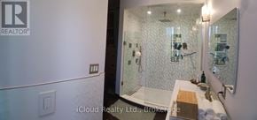 Tiny apartment for rent - A bathroom with a shower and a sink.