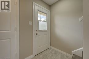 Cambridge townhouse for rent - A white door with a window in the middle of a room.