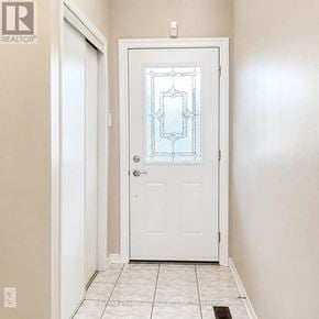 Vaughan (Maple) townhouse for rent - A white door with a glass panel and a handle.