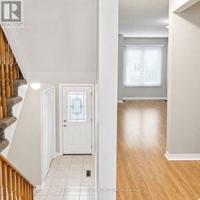 Vaughan (Maple) townhouse for rent - A hallway with a white door and a window with blinds.