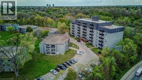 London apartment for rent - A realtor logo is in the corner of an aerial image of apartment buildings.