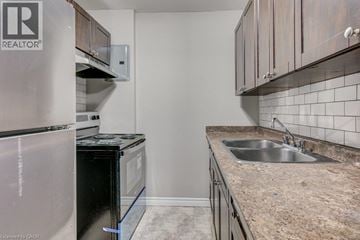 London apartment for rent - A kitchen with a sink and a refrigerator.