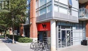 Toronto (Little Portugal) condo for rent - A red storefront with a bicycle parked in front.
