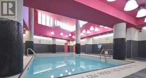 Toronto (Little Portugal) condo for rent - A pool inside a building with a sign that says "REALTOR".