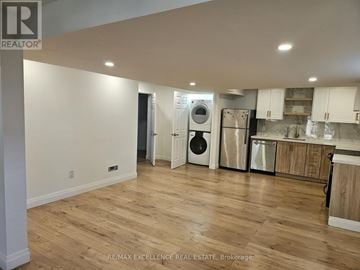 Kitchener apartment for rent - A kitchen with a washer and dryer built in.