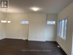 The Nation townhouse for rent - A room with a chandelier and two windows.