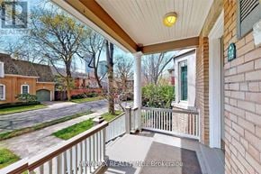 Toronto (Rosedale-Moore Park) apartment for rent - A balcony with a railing overlooks a street with houses.