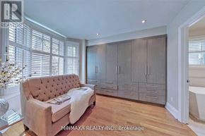Toronto (Rosedale-Moore Park) apartment for rent - A living room with a couch, a glass table, and a cabinet.