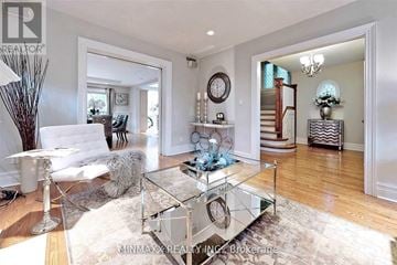 Toronto (Rosedale-Moore Park) apartment for rent - A living room with a glass coffee table and a white couch.