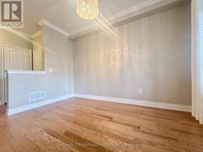 Newmarket (Woodland Hill) townhouse for rent - A room with wooden flooring and a chandelier.