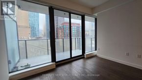 Toronto (Waterfront Communities) condo for rent - A room with a view of the city through large windows.