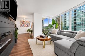 Vancouver apartment for rent - A living room with a grey couch and a coffee table.