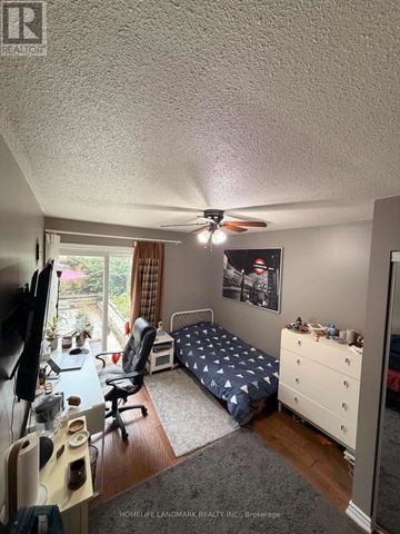 Markham (German Mills) apartment for rent - A bedroom with a bed, desk, and chair.