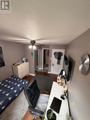 Markham (German Mills) apartment for rent - A bedroom with a bed, desk, and chair.