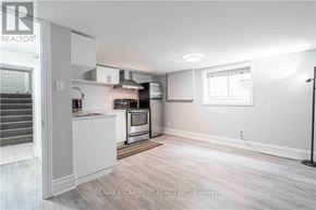 Hamilton (Bonnington) apartment for rent - A kitchen area with a stove top oven and a microwave.