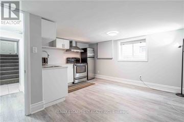 Hamilton (Bonnington) apartment for rent - A kitchen area with a stove top oven and a microwave.