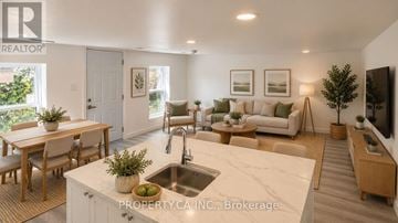 Ottawa triplex for rent - A well-lit, modern kitchen and living room with a dining table and chairs.