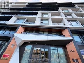 Toronto (Yorkdale-Glen Park) condo for rent - A modern building with a glass entrance and a sign that reads 556.