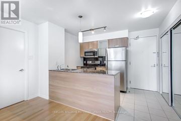 Toronto (Bay Street Corridor) condo for rent - A kitchen with a wooden counter and white appliances.