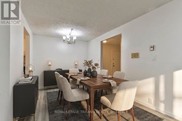 London South (South X) condo for rent - A dining room with a wooden table and chairs.
