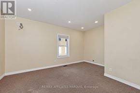 Smiths Falls apartment for rent - A room with a carpeted floor and a window.