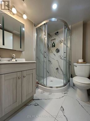 Toronto (Bayview Woods-Steeles) apartment for rent - A bathroom with a marble floor and a walk-in shower.
