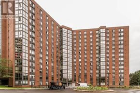 Ottawa condo for rent - A large red brick building with the words "Ideal Properties" written on the front.